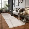 A modern living room with a long runner rug, a sofa, and a side table. Produktbild-Vorschau