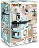 The image shows the packaging of a Smoby Rowenta toy laundry set, featuring product images and promotional text. Produktbild-Vorschau