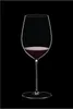 A single wine glass filled with red wine against a black background. Náhled obrázku produktu