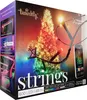 The image shows the packaging of Twinkly Strings LED lights, featuring a Christmas tree illuminated with colorful lights and a smartphone displaying the app interface. Náhled obrázku produktu