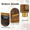 Close-up details of a wooden cabinet with gold hardware, showing magnetic latches, handles, and stable legs. Podgląd zdjęcia produktu