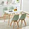 A dining table with four chairs set up in a room. Náhled obrázku produktu