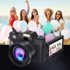 A group of young women are holding balloons and smiling in front of a body of water. A digital camera is in the foreground. Podgląd zdjęcia produktu