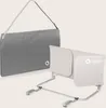 A baby bed rail and its carrying bag are displayed against a light gray background. Voir les images du produit
