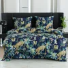 A bed with a duvet cover and pillowcases featuring a jungle print with leopards and tropical plants. Náhled obrázku produktu