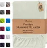 A folded cream-colored fitted sheet with a product information band and a color swatch selection on the left. Produktbild-Vorschau