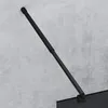 A black shower rod attached to a concrete wall. Produktbild-Vorschau