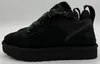 A side view of a black UGG sneaker with a thick sole. Produktbild-Vorschau