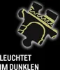 A puzzle piece with gold patterns on a black background, with text below. Náhľad obrázku produktu