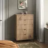 A bedroom scene with a wooden dresser, artwork, and curtains. Podgląd zdjęcia produktu