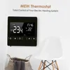 A black thermostat is mounted on a white wall, with a basket and a chair in the foreground. Náhľad obrázku produktu