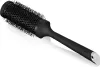 A black radial hair brush with a silver tip is shown against a white background. Podgląd zdjęcia produktu