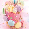 A close-up of a decorated cake with macarons. Náhled obrázku produktu