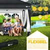 A family enjoying a day outdoors under a black pop-up canopy next to a lake. Anteprima dell’immagine prodotto