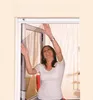 A woman is installing a window screen. Náhled obrázku produktu