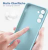 A hand is touching a light blue phone case, highlighting its matte surface and soft grip. Produktbild-Vorschau
