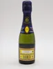 A small bottle of champagne against a white background. Produktbild-Vorschau