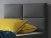 A close-up of a bed headboard with pillows. Produktbild-Vorschau