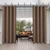 An outdoor patio area with furniture covered by brown curtains. Náhled obrázku produktu