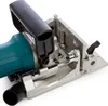 A close-up view of a power tool, specifically a biscuit joiner, showing its base plate, handle, and dust port. Podgląd zdjęcia produktu
