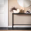 A console table with decorative items in a hallway next to a white door. Náhľad obrázku produktu