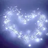 A heart shape made of white LED string lights on a blue background. Produktbild-Vorschau