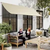 Two women are sitting on a sofa on a patio, under a beige awning. Náhled obrázku produktu