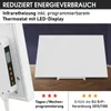 A white infrared heater with a control panel and LED display is shown in a room with a dark blue wall and wooden floor. Text overlays describe its features and energy efficiency. Produktbild-Vorschau