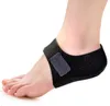 A close-up side view of a person's foot and ankle wearing a black heel support. Produktbild-Vorschau