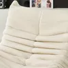 A close-up view of a textured, beige sofa or armchair. Produktbild-Vorschau