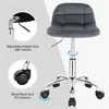A dark gray velvet office stool with a low backrest, shown with callouts highlighting its adjustable height, 360-degree swivel, metal base, and PU casters. Produktbild-Vorschau