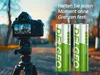 A DSLR camera on a tripod is shown next to two AA batteries, with text overlay. Produktbild-Vorschau
