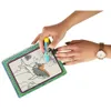 A person's hands are shown coloring in a water book with a special marker. Podgląd zdjęcia produktu