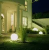 A modern house entrance at night, illuminated by spherical garden lights. Náhľad obrázku produktu