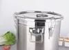 A close-up shot of a stainless steel food storage canister with a lettuce and shrimp in the foreground. Produktbild-Vorschau