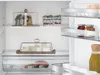 Interior view of a refrigerator with food items. Podgląd zdjęcia produktu