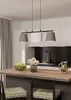 A modern kitchen island with a pendant light fixture above, a bowl of fruit, and a pitcher of lemonade. Voir les images du produit
