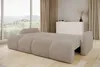 A beige sofa bed is shown in a living room setting with large windows and curtains. Podgląd zdjęcia produktu