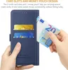 A hand is inserting a banknote into a blue leather phone case with card slots. Produktbild-Vorschau