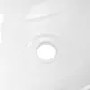 A close-up view of a white ceramic sink drain. Produktbild-Vorschau