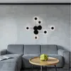 A modern living room with a grey sectional sofa and a coffee table. Produktbild-Vorschau