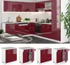 A modern kitchen with red high-gloss cabinets and white countertops. Náhled obrázku produktu