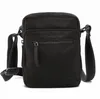 A black leather crossbody bag is shown against a white background. Anteprima dell’immagine prodotto