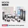 A collection of bathroom accessories from the tesa MOON SERIE, displayed in their packaging against a blurred bathroom background. Náhled obrázku produktu