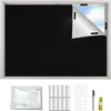 A black blackout roller blind is shown installed on a window, with a corner peeled back to reveal the sky. Below the window, the accessories for installation are laid out: a bag of what appears to be the blind material, velcro strips, circular adhesive pad Produktbild-Vorschau