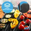 Close-up of a grill with various vegetables being grilled, with a marketing overlay. Produktbild-Vorschau