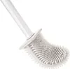 A close-up, angled view of a white silicone toilet brush with a white handle, set against a plain white background. Náhľad obrázku produktu