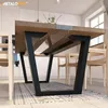 A modern dining table with V-shaped steel legs in a bright, contemporary kitchen setting. Produktbild-Vorschau
