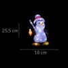 A lit-up acrylic penguin figurine with a fishing rod and a lure, set against a black background. Dimensions are indicated by measurement lines and text. Podgląd zdjęcia produktu