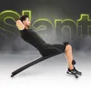 A man is performing a sit-up exercise on a slant bench, with neon text in the background. Anteprima dell’immagine prodotto